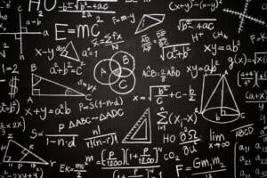 Blackboard inscribed with scientific formulas and calculations i